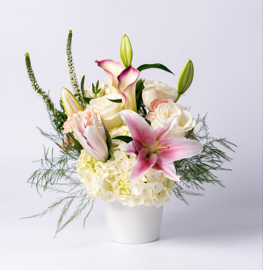 Elegant pastel vase with stargazer lilies, calla lilies, white roses, and hydrangea. A soft, romantic gift. Same-day Toronto flower delivery